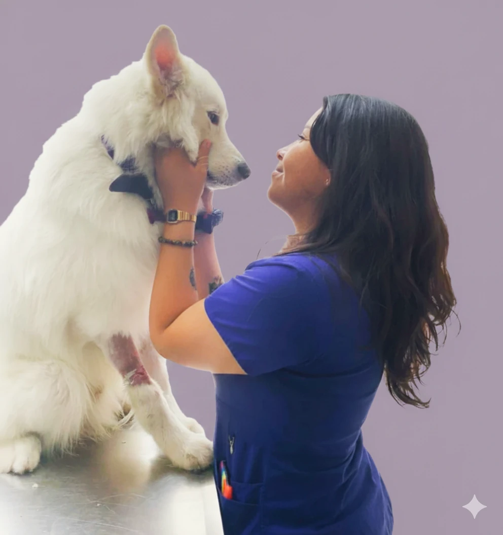 Veterinaria abrazando perro